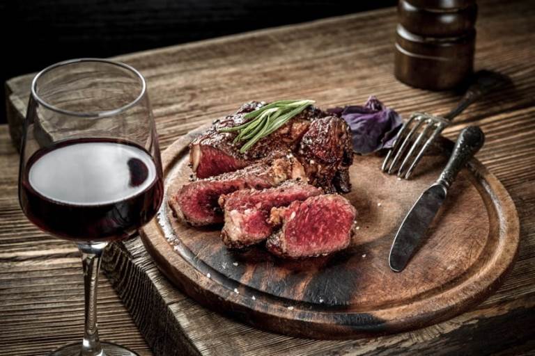 grilled-ribeye-beef-steak-with-red-wine-herbs-and-spices-on-wooden-table.jpg (78 KB)